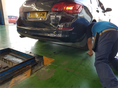 ITV import technician measures rear axle width to ensure conformity ITV import technicial measuring axle